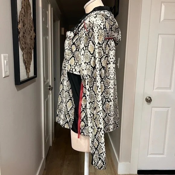 ALALA snakeskin anorak with red accents